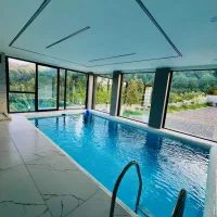 کلبه جنگلی لوکس دیار استخرسرپوشیده و جکوزی رو روف|اجارهٔ کوتاه‌مدت ویلا و باغ|رامسر, |دیوار