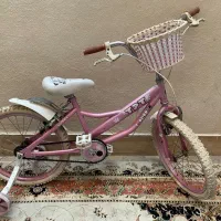 دوچرخه سایز ۲۰ صورتی دارای کمکی