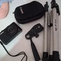 دوربین کنون فوری فروشی همراه  پایه دوربین رایگان