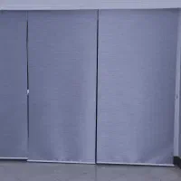 تعدادی پرده شید رول ترک رنگ نقره ای آبی براق