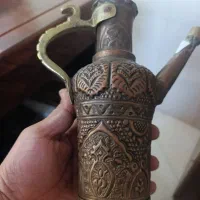 یک عدد افتابه ویک عدد اب پاش