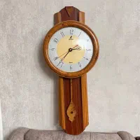 ساعت دیواری و قاب گل