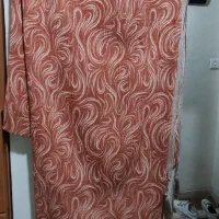 تعدادی شال و روسری و مانتو و ساحلی