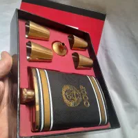 ست قمقمه جیبی و شات استیل طلایی با روکش چرم