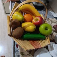 میوه مصنوعی همراه با سبد چوبی