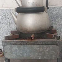 اجاق گاز تک شعله به همراه کتری و قوری باغی