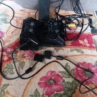 یک عدد پلی استیشن 2 بفروش میرسد.