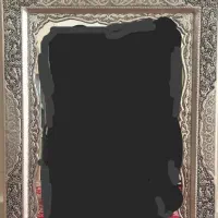 یک آیینه ودو عدد شمعدانی ویک پشتی آیینه