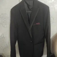 یک دست کت و شلوار نو