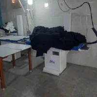 تعدادی خیاط وسط کار وبسته بندلباس تریکو