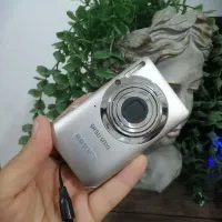 دوربین Canon IXUS و سه پایه دوربین fancier ft3720