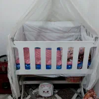 گهواره کنار مادر