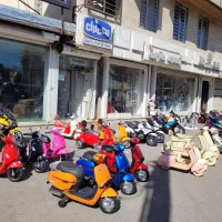 فروشگاه بزرگ موتور شارژی موزیکال دوموتوره نئونی