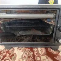 فر و توستر روی خود دستگاه هم بالای سمت راست نوشت