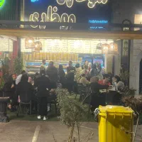 فروشنده ، صندوق دار ، وسط کار ، کارگر ساده