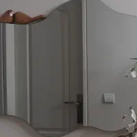 اینه دفرمه دیواری