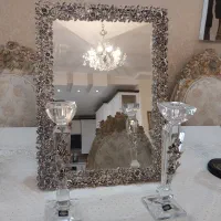 آینه شمعدان بسیار زیبا بعلت مهاجرت بفروش می‌رسد.‌
