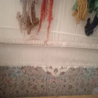 دستگاه قالی به همراه قالی نیمه بافت