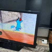 ال ای دی ۴۲ اینچ ال‌جی اصل کره به همراه میز چوبی