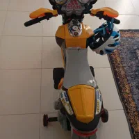 متور اسباب‌ بازی کودک به همراه کلاه ایمنی|اسباب‌‌بازی|فولادشهر, A4|دیوار