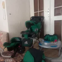 کالسکه.کریر. ساک. روراک.به رنگ مشکی و سبز