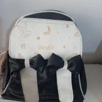 سه عدد کوله پشتی|کیف، کفش، کمربند|قم, قلعه کامکار|دیوار