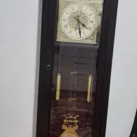 ساعت ایستاده و ایینه ارایش