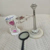 ذره بین ساعت شنی برج میلاد
