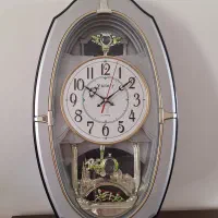 ساعت دیواری آونگ دار