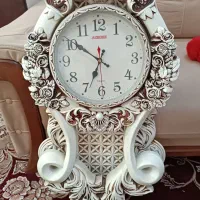 ساعت و میز تلویزیون و جا سیب زمینی پیاز