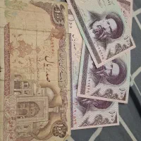 تعدادی اسکناس قدیمی نو و صد هزار ی امضا قرمز همتی