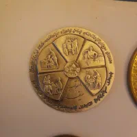 سکه یادبود نقره ۹۹۹ عیار و انگشتر نقره، و اسکناس