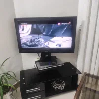 تلویزیون به همراه میز تلویزیون سونی