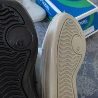 کفش کار|کیف، کفش، کمربند|مهاجران, |دیوار