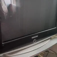 تلویزیون به همراه میز و گیرنده