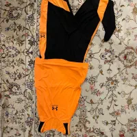 ست تاپ و لگ ورزشی مشکی نارنجی زنانه