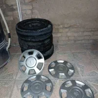 رینگ 14و لاستیک 185بارز و قالپاق تیوفایوی کمک فنر