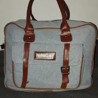 ساک نوزادی دسته و بند چرم