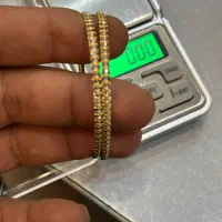 یک عددالنگوطلای دست دوم ۳۰۰بالای تابلو