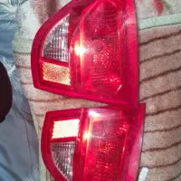 مقداری لوازم کوییک چراغ و سپر و بال عقب