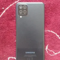 گوشیa12و ویترین مغازه