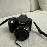 دوربین عکاسی کنون به همراه کتاب راهنما