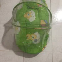 کیسه خواب و پشه بند نوزاد همراه با آغوش بند نوزاد