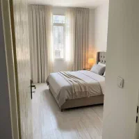 ۵۲متری/پارکینگ غیرمزاحم/پاسیو/عروسک/کرمان جنوب