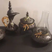 دو عدد شمعدان ست و شکلات خوری و ظروف تزئینی سفالی