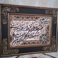 یک عدد تابلو و آینه و شمعدان