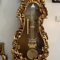 ساعت ایستاده و تابلو طلا کوب