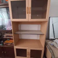 کابینت تلویزیون وسایل و گل و کتاب
