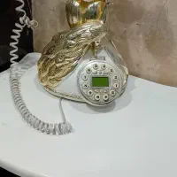 تلفن رومیزی به همراه میز تلفن
