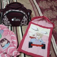 کیف و آغوشی و قنداق نوزاد دخترانه